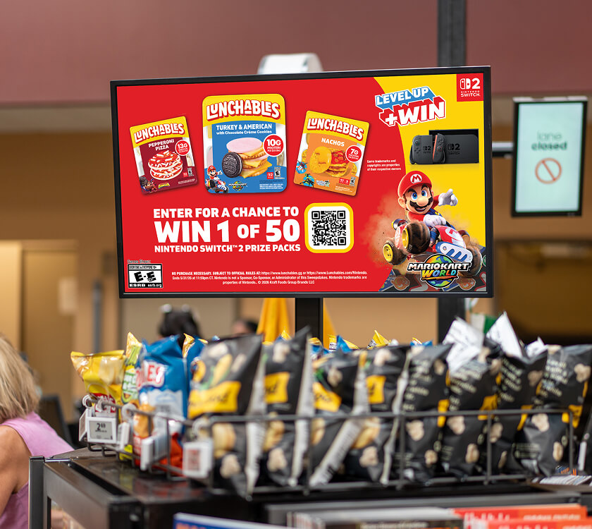 Image of a digital screen showcasing Kraft Heinz at the grocery store front end