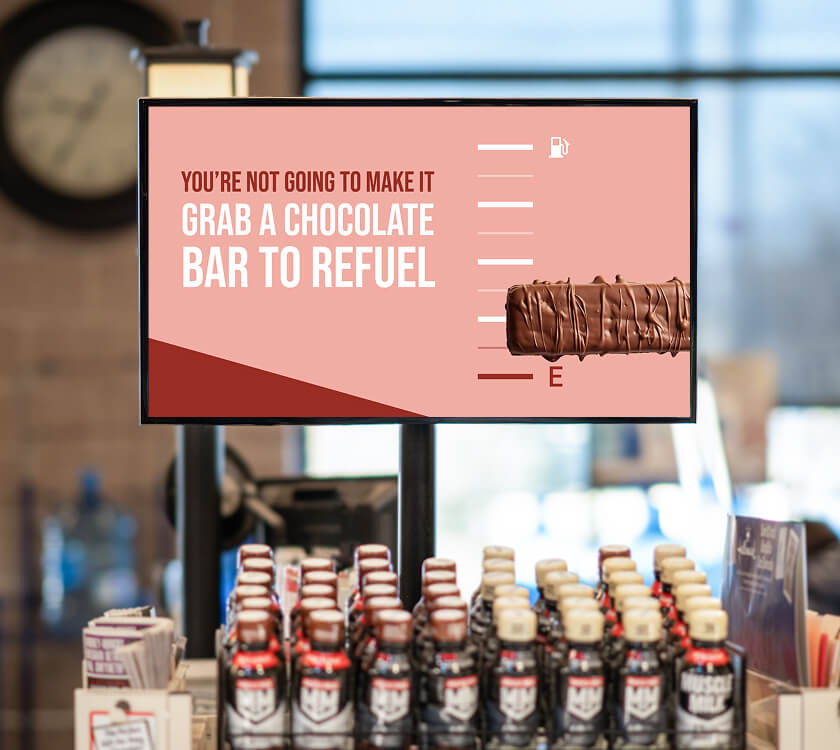 Image of a digital screen showcasing an meta study brand at the grocery store front end