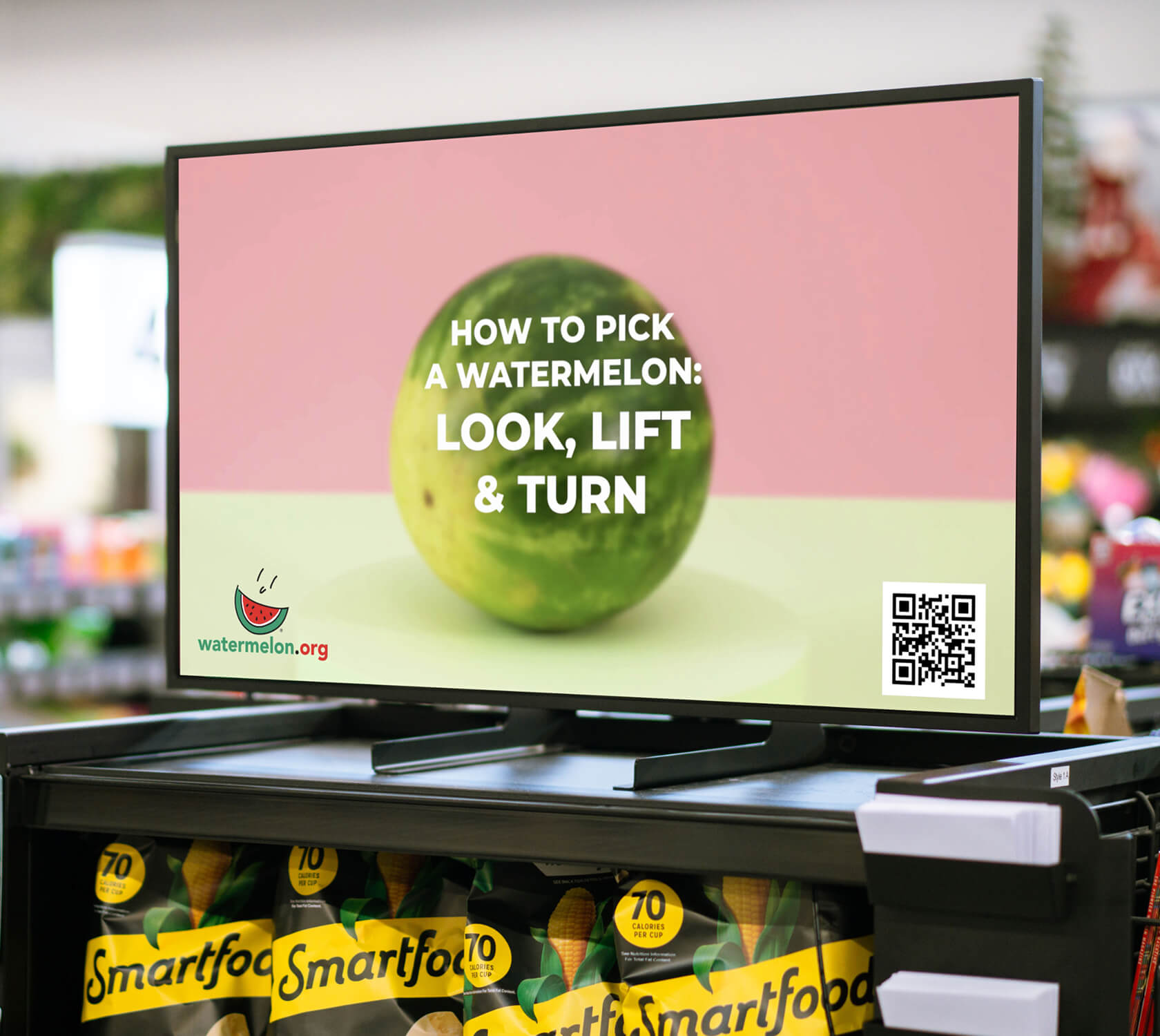 Image of a digital screen showcasing a watermelon brand at the grocery store front end